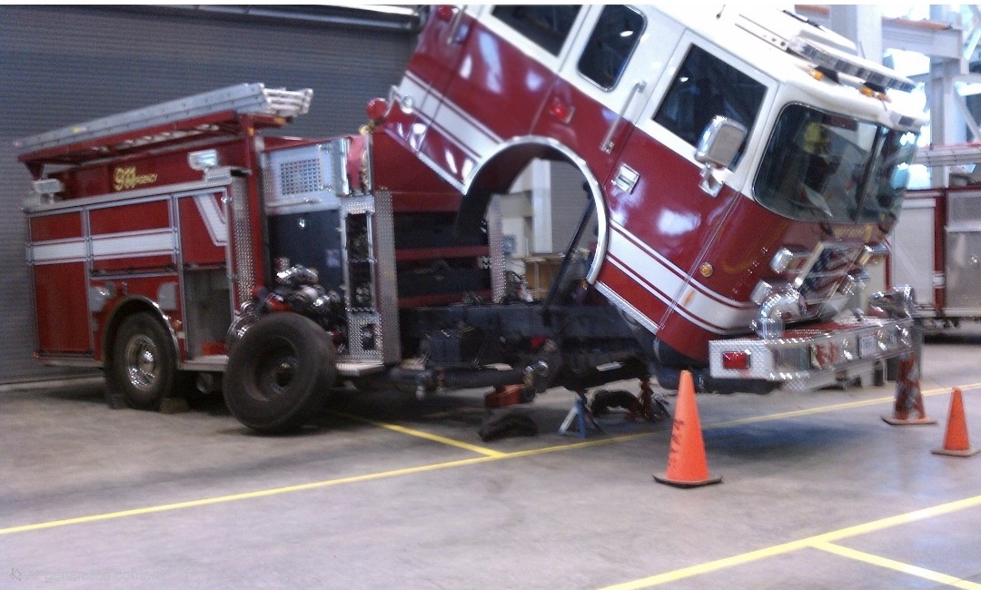 Fire engine with cab tilted forward exposing engine and drivetrain components for service